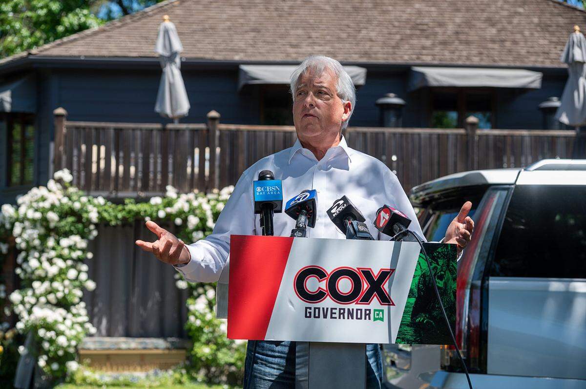 John Cox, Republican gubernatorial recall candidate, campaigns on Tuesday, May 4, 2021, in Yountville across the street from The French Laundry restaurant, the site of an infamous birthday dinner attended by Gov. Gavin Newsom despite state COVID-19 restrictions. Cox kicked off a three-day bus tour in Sacramento with a live bear named Tag earlier in the day, but the bear was absent from his second appearance.