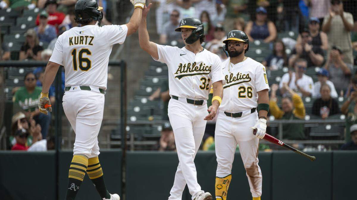 Athletics first base Nick Kurtz (16) and Athletics outfielder Colby Thomas (32) high five after Kurtz’s home run during a game between the Athletics and the Kansas City Royals at Sutter Health Park in West Sacramento on Sunday, Sept. 28, 2025.