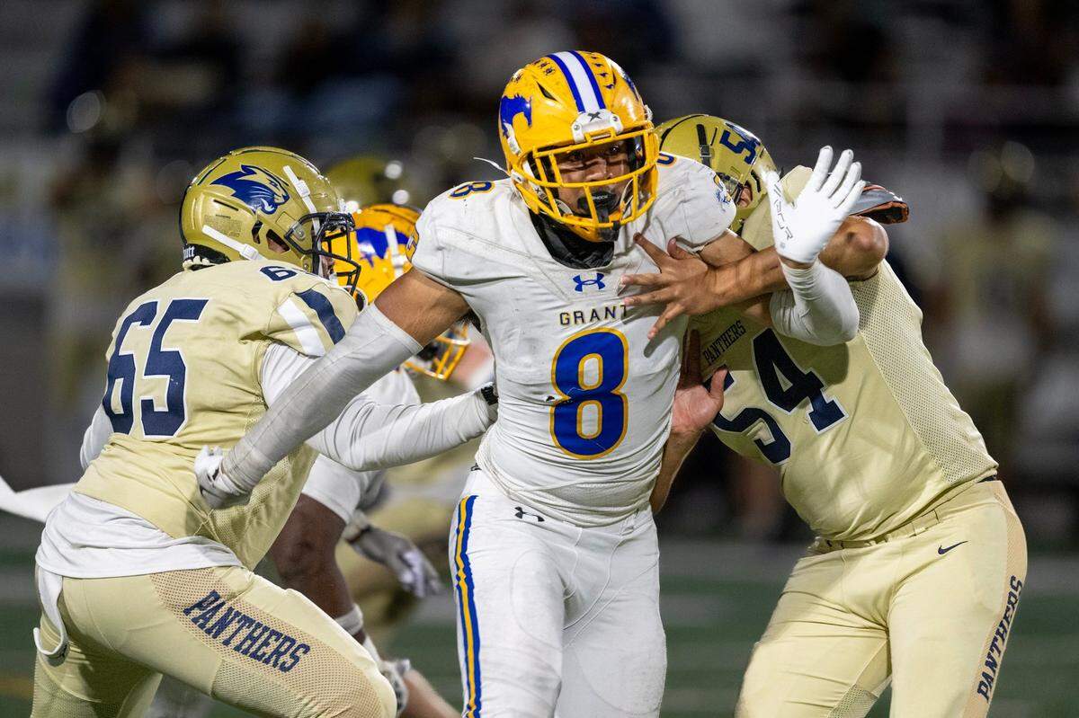 Grant defensive lineman Jeremiah Tuiileila (8) gets past West Park Panthers blockers in October.