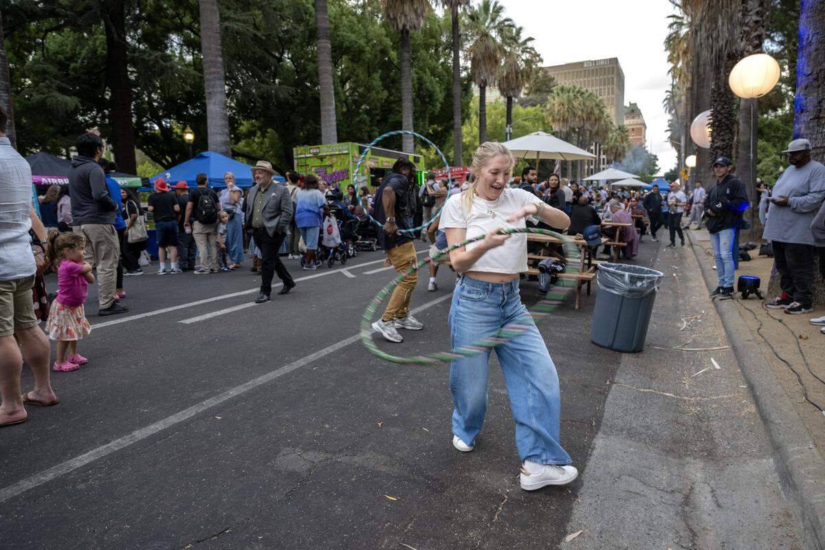 Islay Nicklin of Orange County hoops during a 175th birthday block party to celebrate California's anniversary of statehood on Tuesday, Sept. 9, 2025, at the state Capitol.
