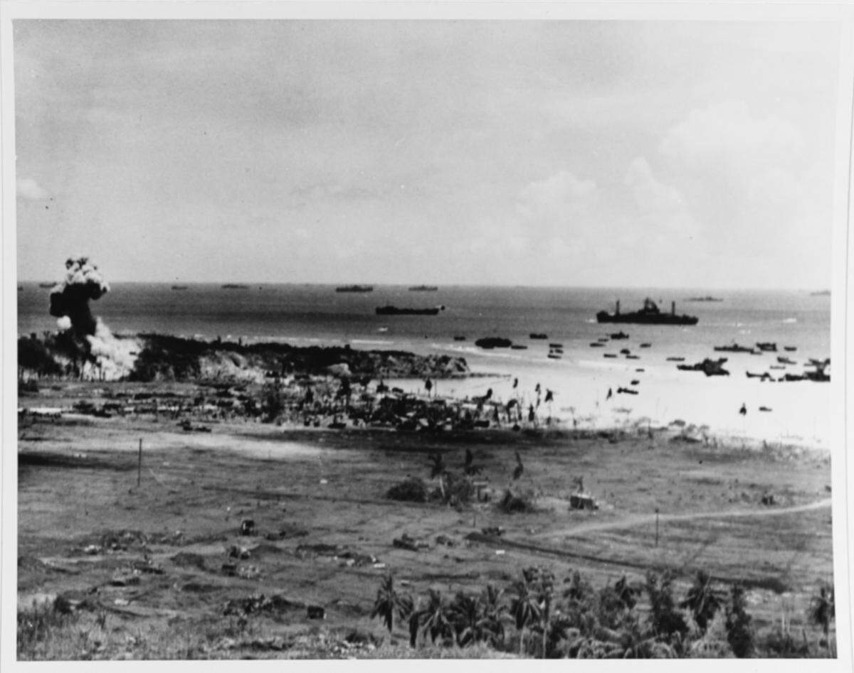 An enemy dugout is blown up near the Northern Assault Beaches of Guam in July 1944.