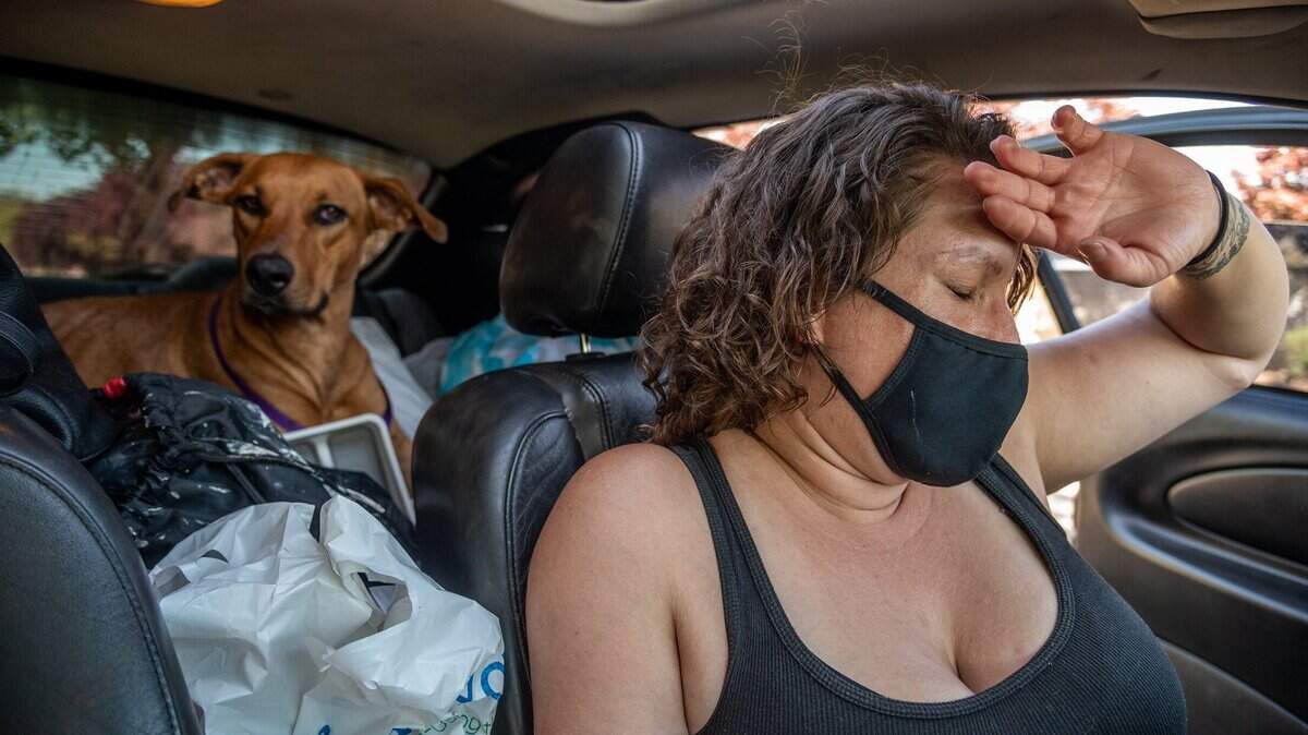 “My brain just shuts down because it is so overwhelmed with everything,” said Britt Macias, 36, on Thursday, May 6, 2021. She has been living in her car with her dog Bullet since being evicted from her home in Sacramento. California leaders are exploring a third extension of the eviction moratorium enacted last year to protect renters during the pandemic.