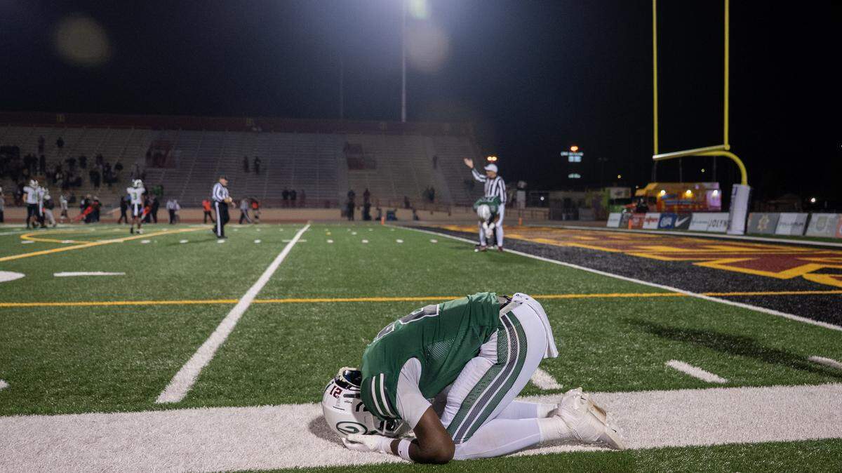 The Granite Bay Grizzlies' Darnell Turner (2) reacts after a interception sealed the win for the St. Mary’s Rams in the second half of the CIF Sac-Joaquin Section Division ll football championship on Saturday at Hughes Stadium in Sacramento.