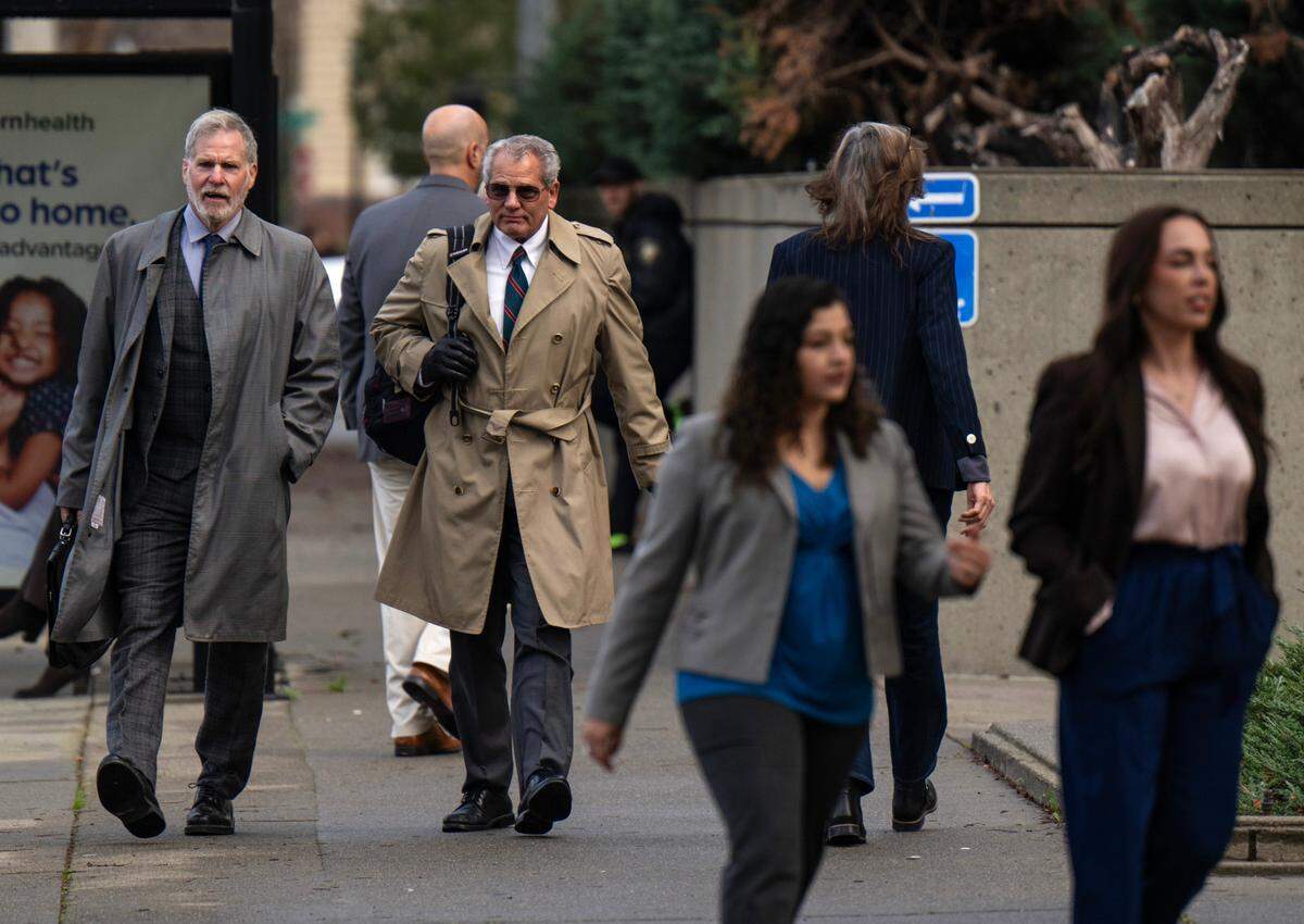 Extras are filmed leaving the Sacramento County Courthouse in downtown Sacramento in a scene for a new Paul Thomas Anderson movie on Saturday.