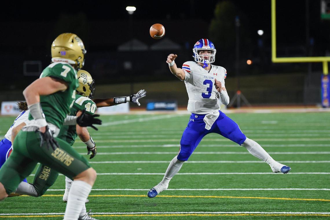 Folsom Bulldogs quarterback Ryder Lyons (3) passes to wide receiver Jameson Powell (9) for a touchdown with less than a minute left in the CIF state Division 1-A football championship game against the St. Bonaventure Seraphs on Dec. 9 in Mission Viejo.