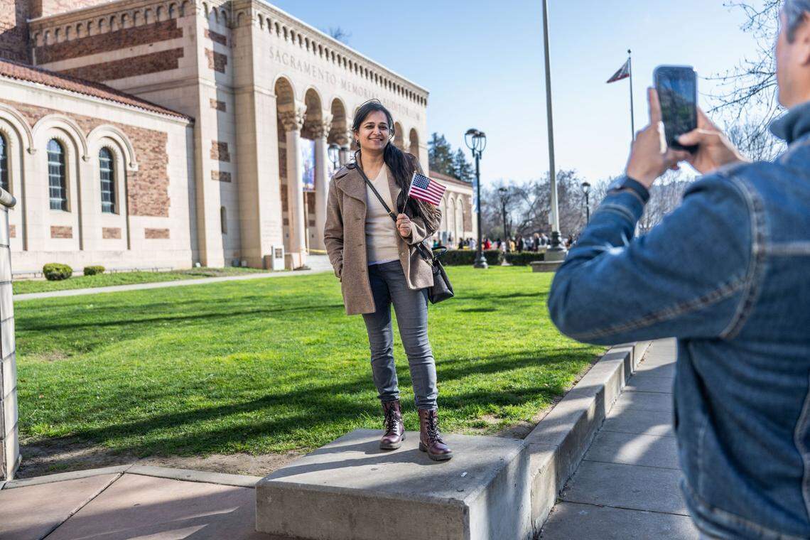 Fairfield resident Shrishti Pant, originally from Nepal, has her photo taken in front of the Memorial Auditorium in Sacramento after participating in a naturalization ceremony where more than 800 people took the oath to become U.S. citizens on Wednesday.