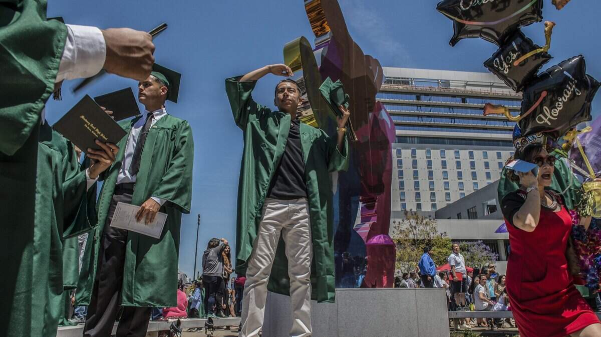 Ramon Brugara, 17, center, looks for family and friends after his graduation ceremony from Monterey Trail High School at Golden 1 Center on Monday, May 22, 2017. Elk Grove Unified’s school board has approved a contract to host graduation ceremonies for its nine high schools at Golden 1 Center.