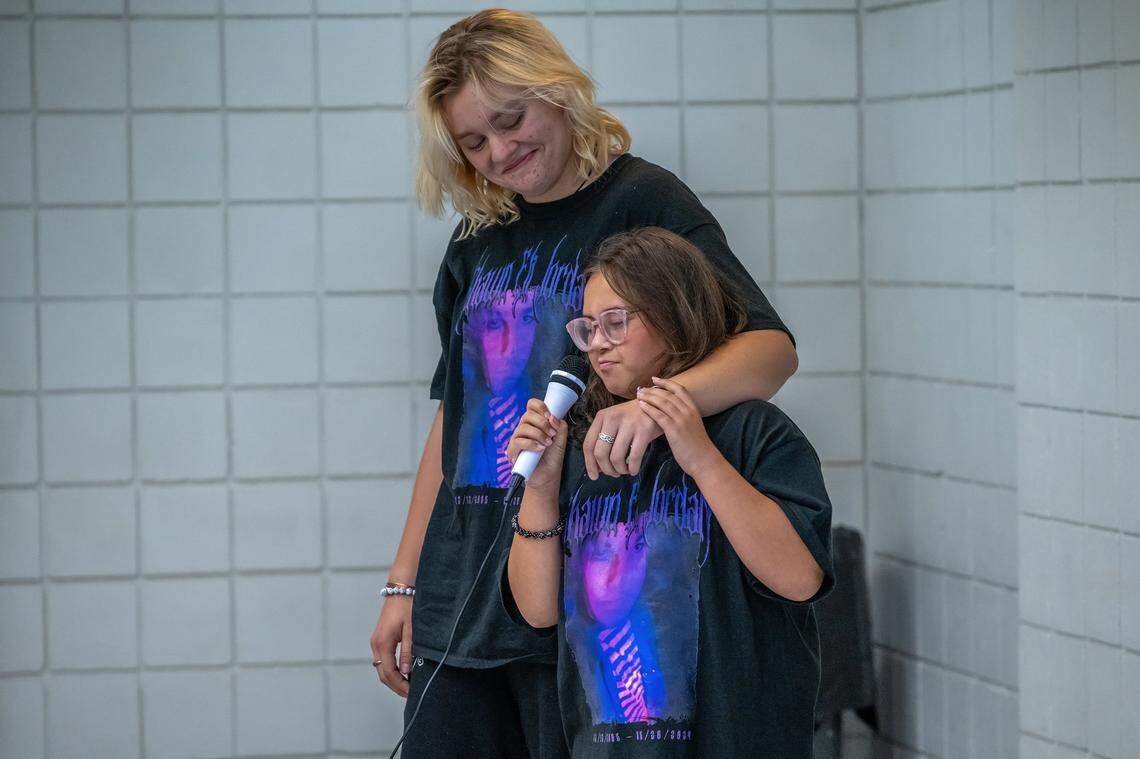 Lennox Jordan, 10, gives a short eulogy for her brother Shawn Jordan with the arm of Shawn’s boyfriend Sal Eldridge wrapped around her shoulder at his celebration of life memorial on July 28. She talked about how Shawn loved his family, Sal and his cat Razzle. “He wouldn’t hurt a fly and he was very sweet,” she said.
