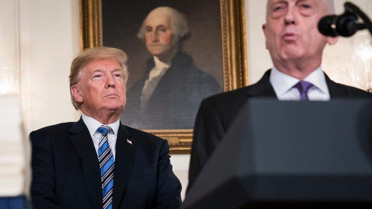 President Donald Trump listens to Defense Secretary Jim Mattis speak in the Diplomatic Reception Room at the White House in March 2018.