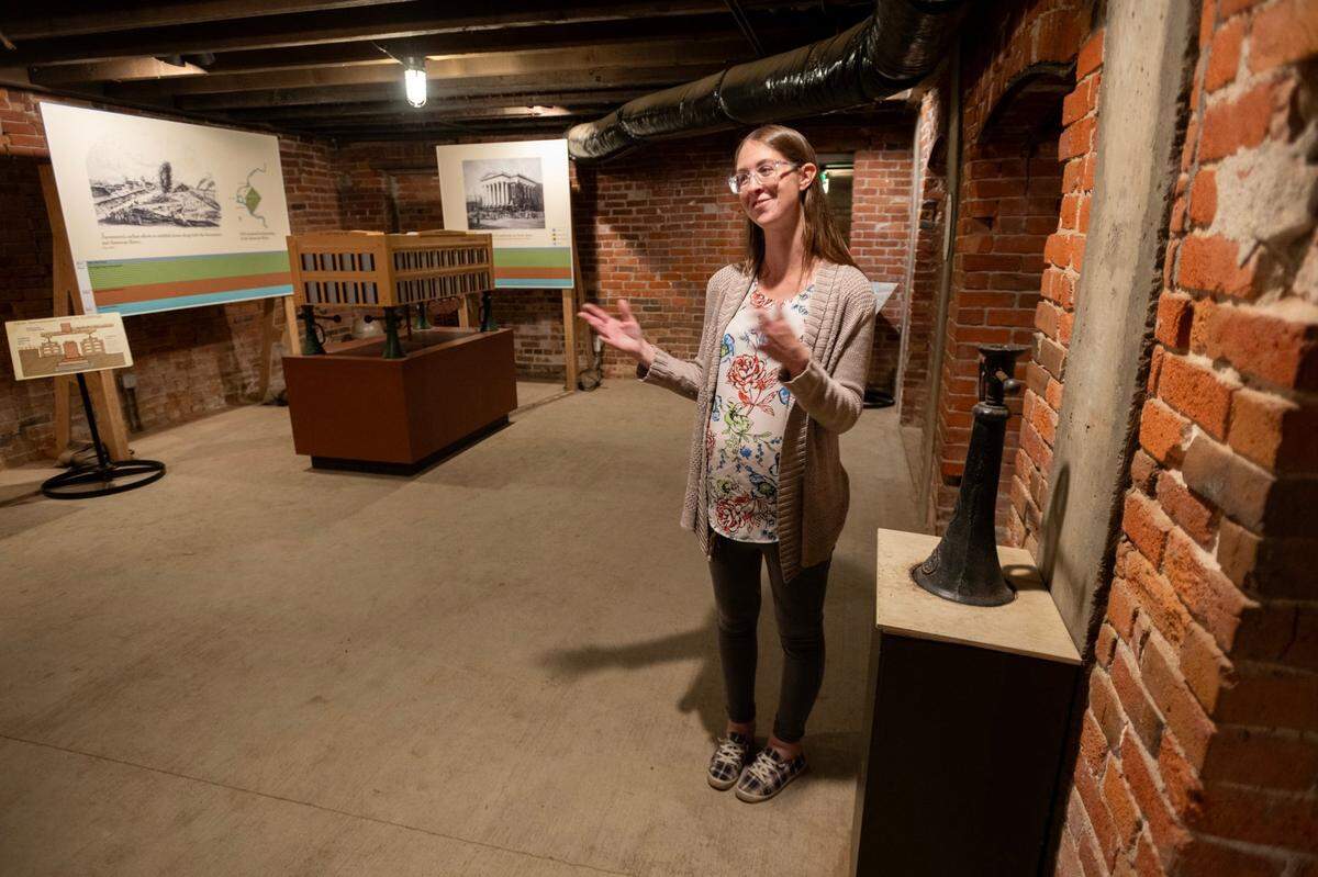 Aly Kowalski, experience manager for the Sacramento History Museum, stands in the basement of Old Sacramento’s B.F. Hastings building on Friday, Aug. 23, 2024, as she explains how jacks were used to elevate the building in 1864 when the city’s roads were raised to help reduce flooding.