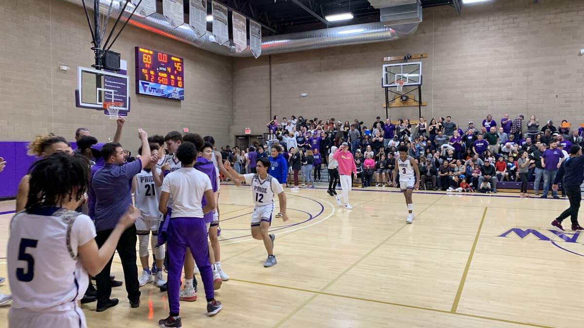 Bradshaw Christian players and coaches celebrate a 60-45 win over Denair on Tuesday night.