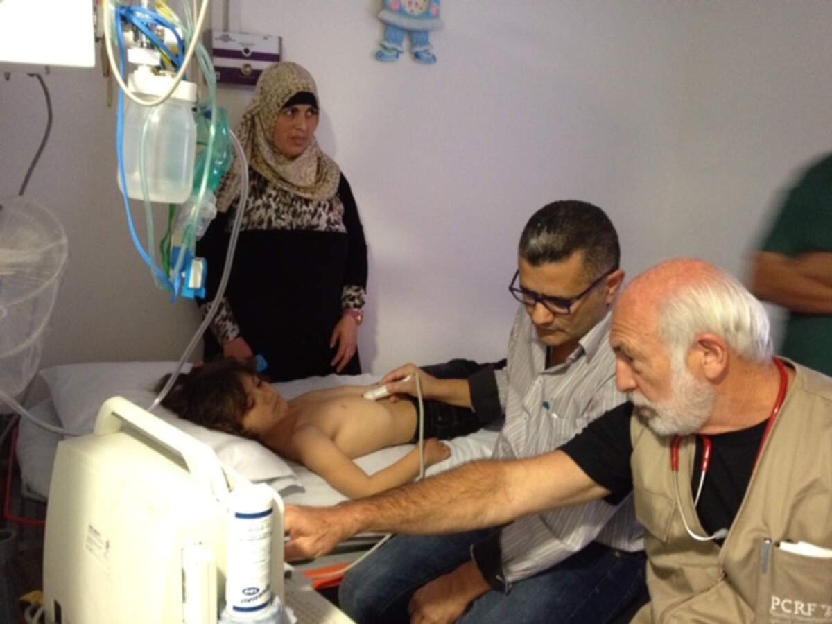 The author with Dr. Mohammed Najajrah, Chief of Pediatric Oncology at Bet Jala Hospital, providing instruction in performing echocardiograms on children undergoing cancer treatment as per protocol to avoid adverse cardiac effects.