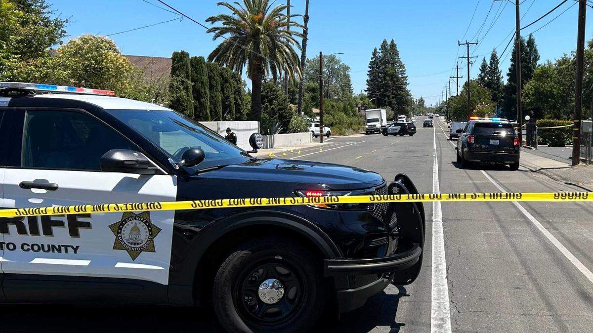 Deputy vehicles and police tape mark the scene where a 16-year-old boy was shot and wounded during a fight between two groups of teens on Gannon Drive at Hurley Way on Monday in Arden Arcade. Two teens, age 14 and 17, were taken into custody in connection with the incident.