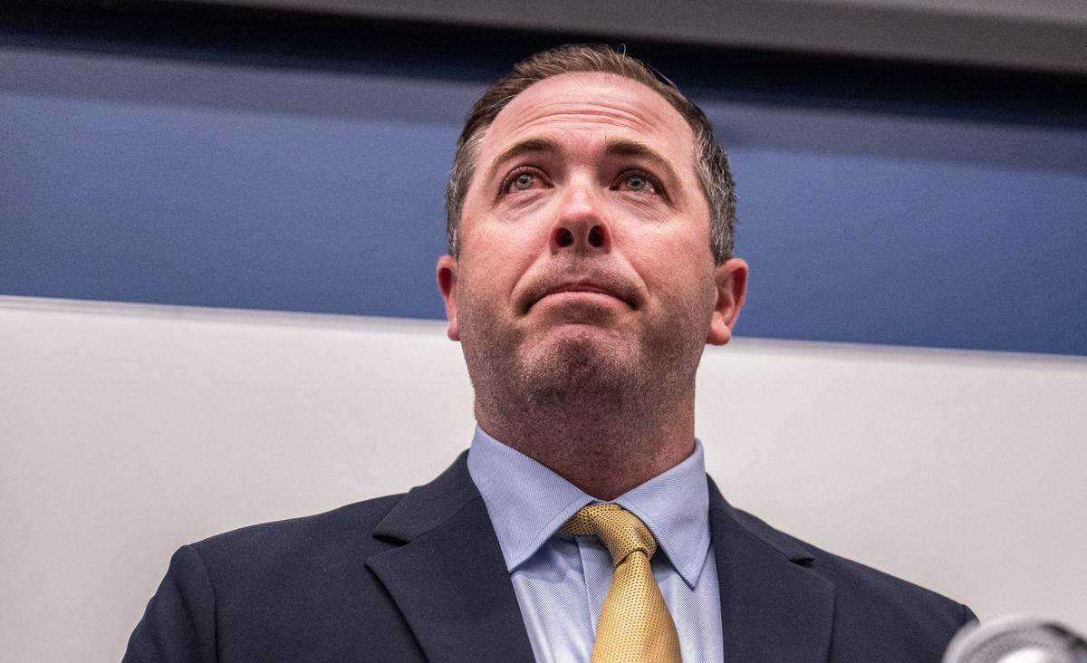 Tim Plough holds back tears as he prepares to give a statement after he was officially introduced as the new UC Davis head football coach on Monday, Dec. 4, 2023.