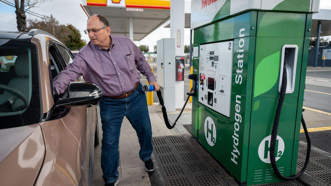 Hydrogen car owner Gregg Fishman stands at a hydrogen station in West Sacramento in March. California’s hydrogen hub supports clean energy, job creation and economic growth while helping achieve California’s climate-neutral goals by 2045.