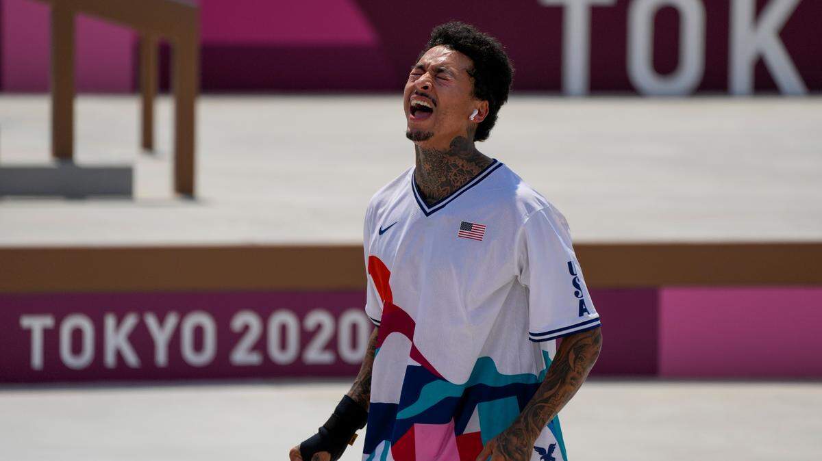 Nyjah Huston is dejected after falling during a trick in the men’s street skateboarding at the 2020 Summer Olympics, Sunday, July 25, 2021, in Tokyo.