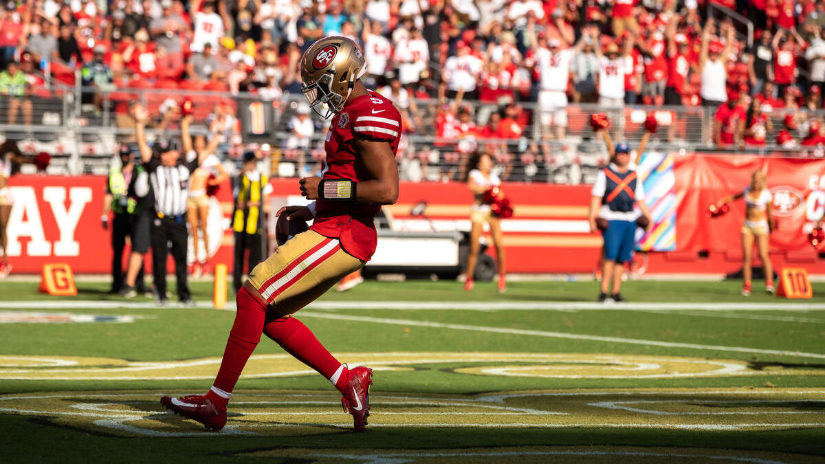 San Francisco 49ers quarterback Trey Lance (5) coasts into the end zone to score on a two-point conversion against the Seattle Seahawks during the fourth quarter of the NFL football game Sunday, Oct. 3, 2021, at Levi’s Stadium in Santa Clara. The Seahawks beat the 49ers 28-21.
