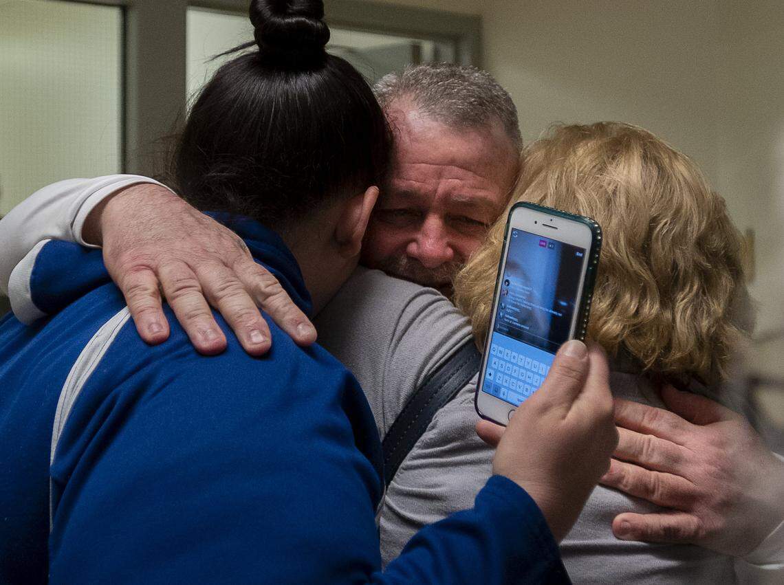 Ricky Leo Davis is released from custody and hugs mom Maureen Klein, right, and another family member at the El Dorado County Jail after he was exonerated in the 1985 murder of Janet Hylton on Thursday, Feb 13, 2020 in Placerville. DNA evidence used to exonerate Davis led police to arrest another suspect Tuesday.