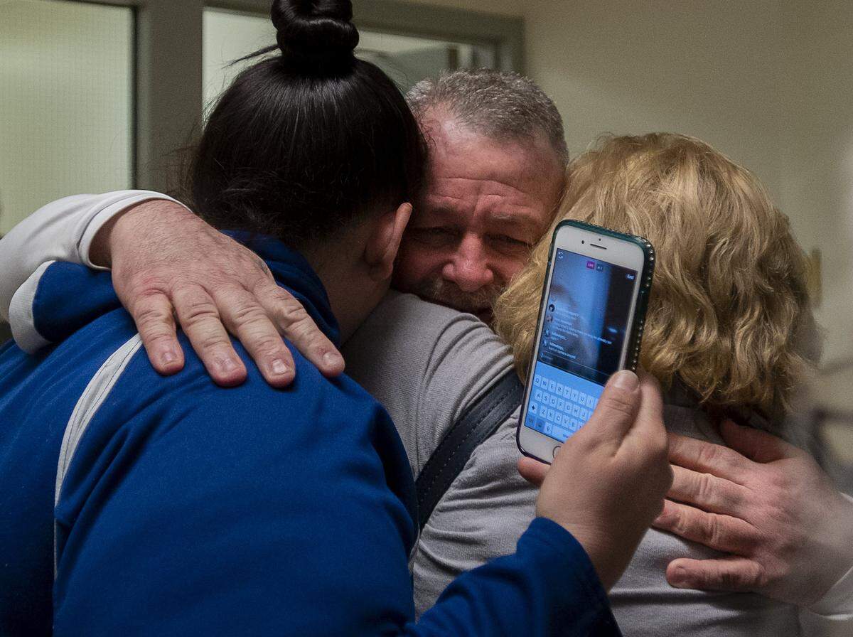 Ricky Leo Davis is released from custody and hugs mom Maureen Klein, right, and another family member at the El Dorado County Jail after he was exonerated in the 1985 murder of Janet Hylton on Feb. 13, 2020, in Placerville. Davis’ girlfriend, now-deceased Connie Dahl, had her voluntary manslaughter charge vacated Friday in court.
