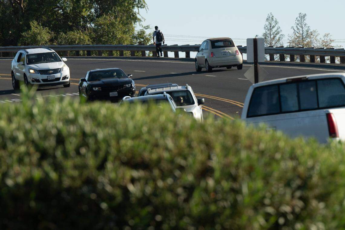 Jahison Tracy walks on a bike path on the Walerga Road overpass in North Highlands in October. The high school junior attends Creative Connections Arts Academy and said he thinks the road is unsafe for students.