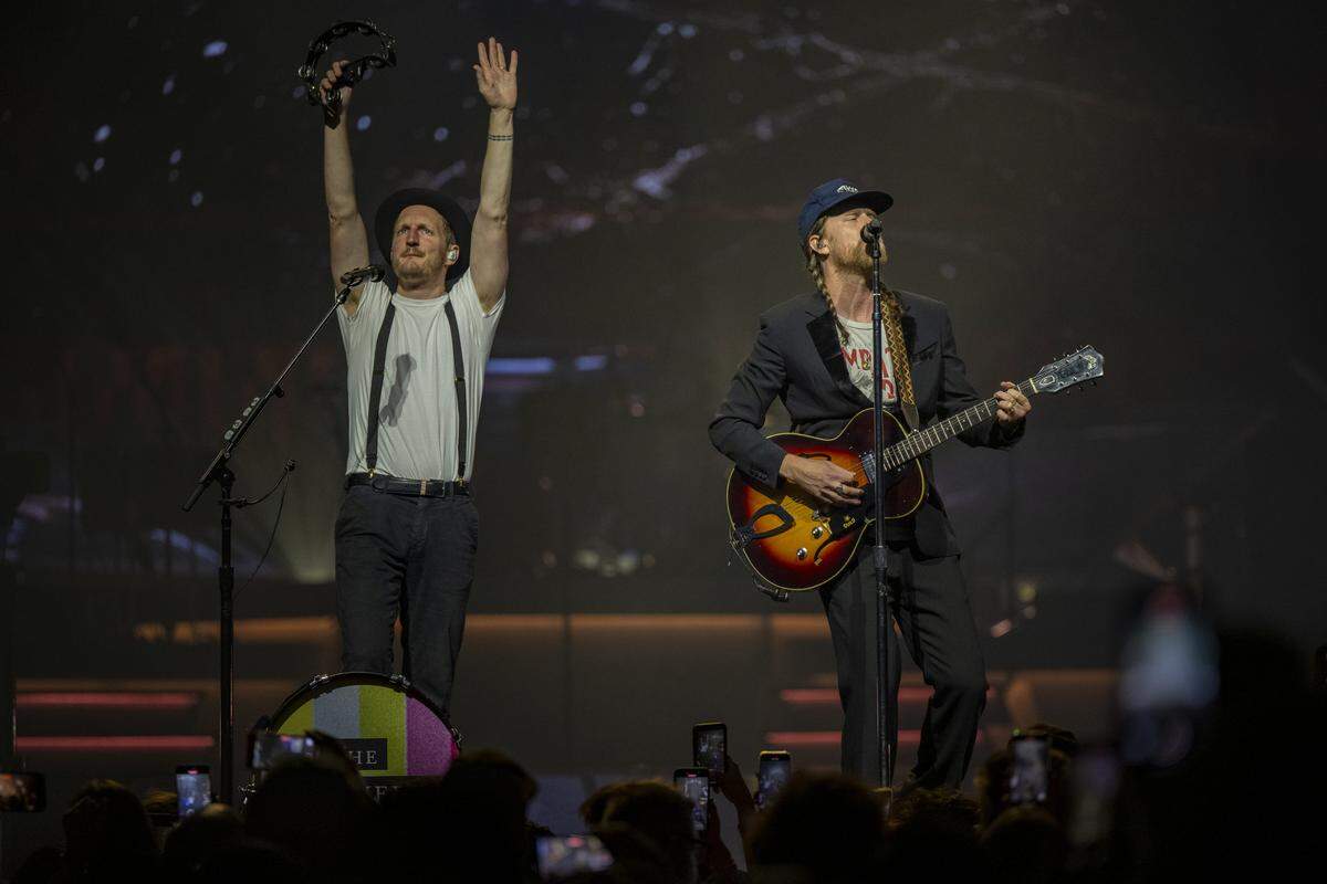 Jeremiah Fraites, on drums and percussion, right, and Wesley Schultz, lead singer, left, perform “Flowers In Your Hair” at Golden 1 Center in downtown Sacramento on Wednesday.
