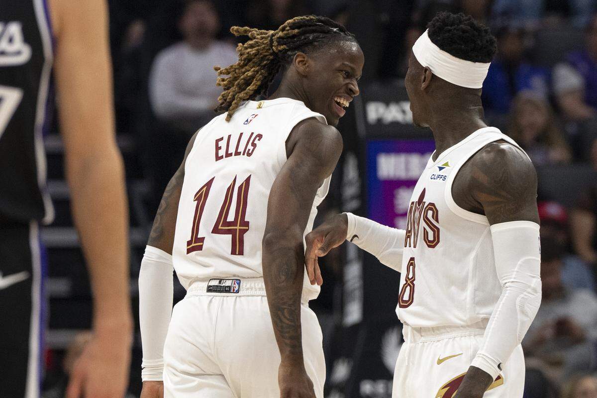 Cleveland Cavaliers guard Keon Ellis (14) and Cleveland Cavaliers guard Dennis Schroder (8) react during a game at Golden 1 Center in Sacramento on Saturday, Feb. 7, 2026.