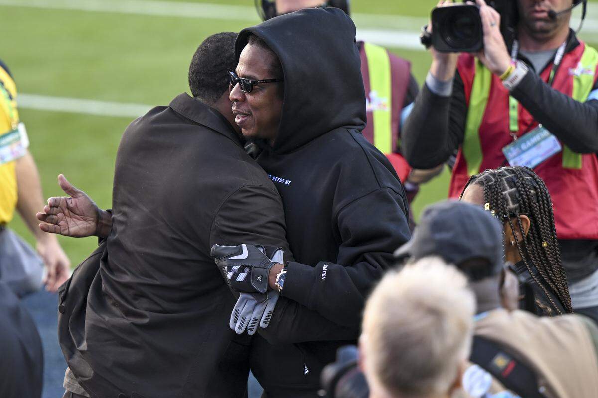 Singer Jay-Z gives a hug before the start of Super Bowl LX at Levi’s Stadium in Santa Clara on Sunday, Feb. 8, 2026.