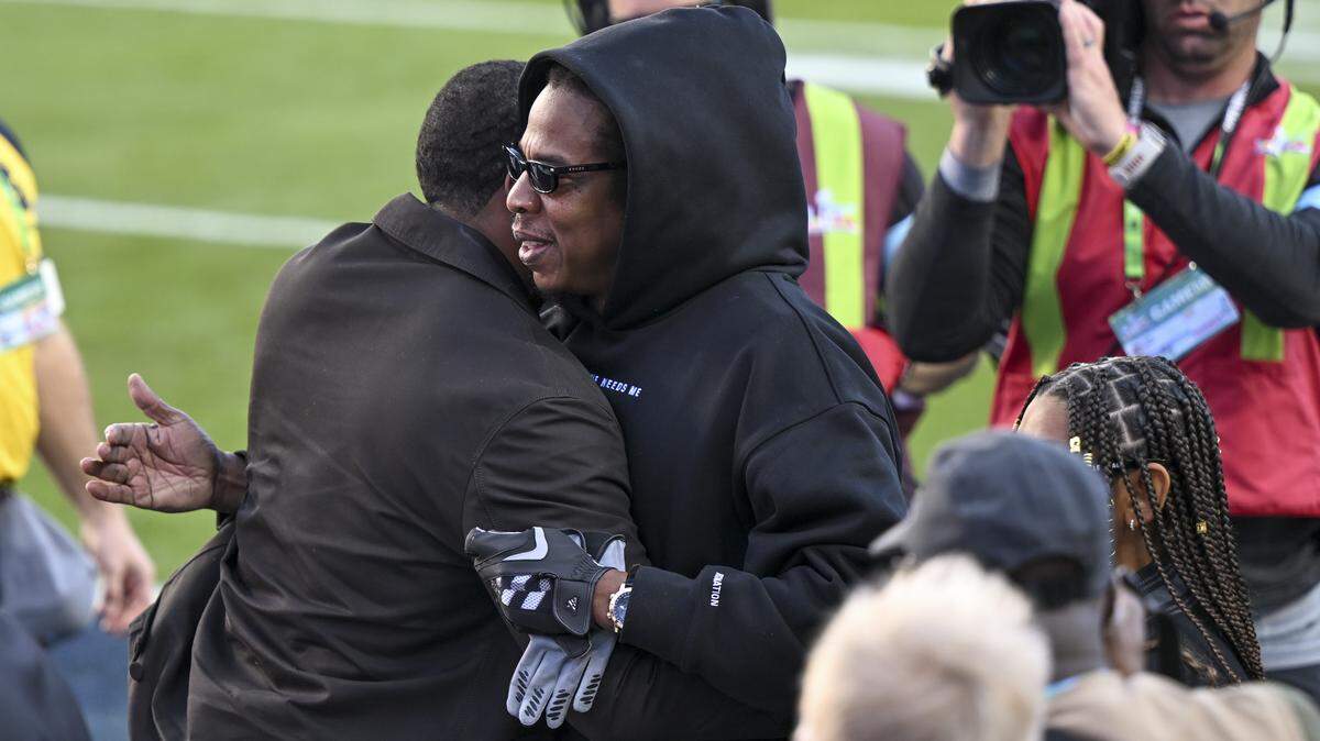 Singer Jay-Z gives a hug before the start of Super Bowl LX at Levi’s Stadium in Santa Clara on Sunday, Feb. 8, 2026.