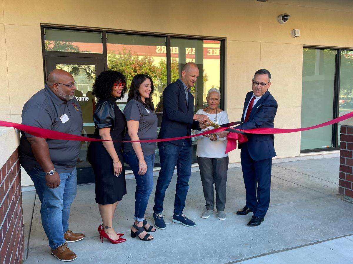 Assemblyman Kevin McCarty, center, Los Rios Board of Trustees President Pamela Haynes, right, and Sacramento City College President Albert Garcia, far right, cut the ribbon at the Panther Cares Center grand opening on Oct. 29. The center offers support for Sacramento City College students facing food and housing insecurity.