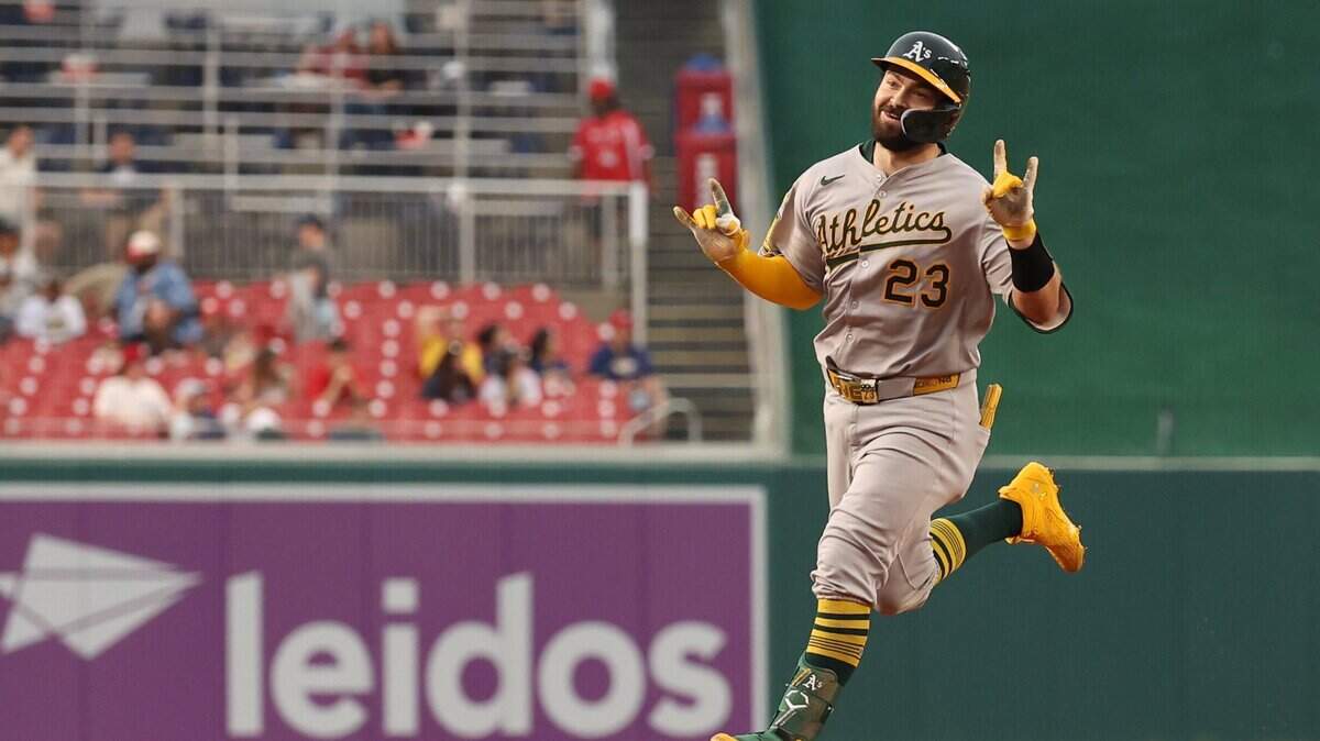 Athletics catcher Shea Langeliers (23) gestures to his dugout while rounding the bases after hitting a leadoff home run against the Washington Nationals during the first inning Tuesday at Nationals Park in Washington, D.C.