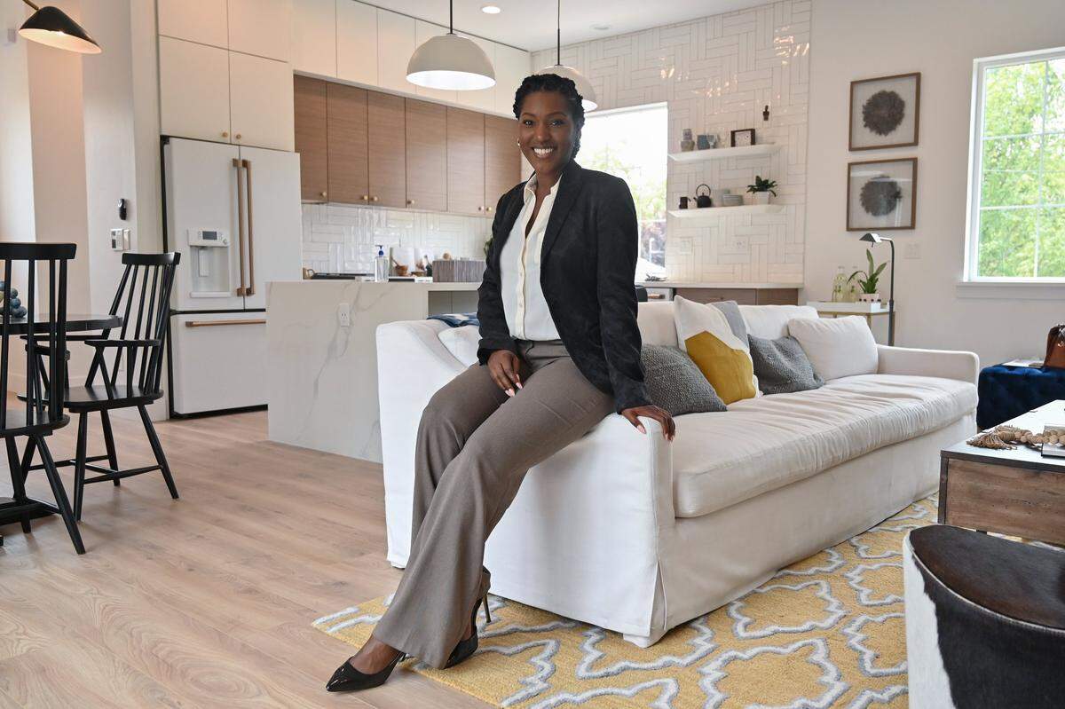Real estate agent Syndi Chattman gives a home tour in Curtis Park on Sunday, Aug. 15, 2021.