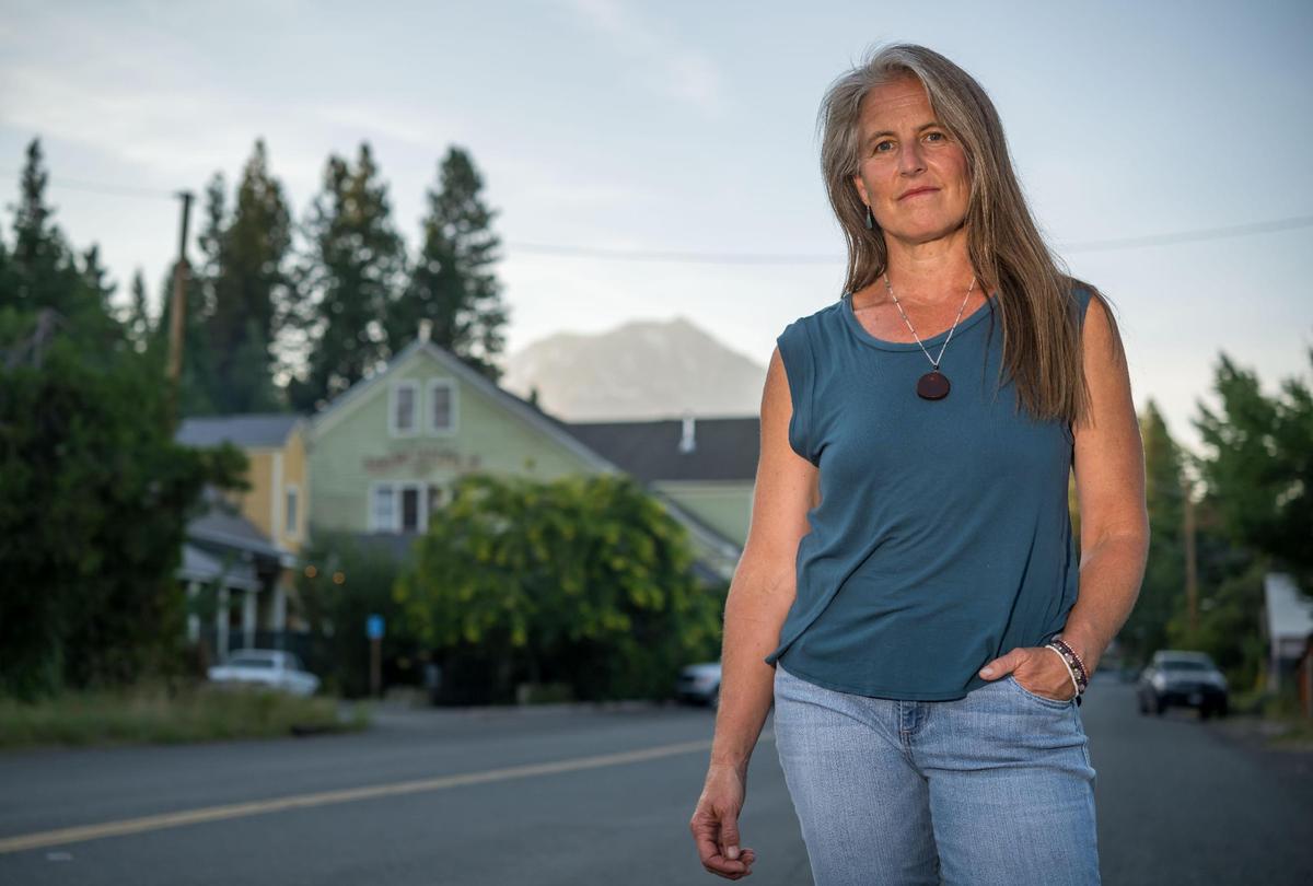Angelina Cook, a Democrat and longtime Siskiyou County resident, is running her second campaign for a seat on the non-partisan Siskiyou County Board of Supervisors. She stands on Main Street in McCloud on Aug. 8 with Mount Shasta in the distance.
