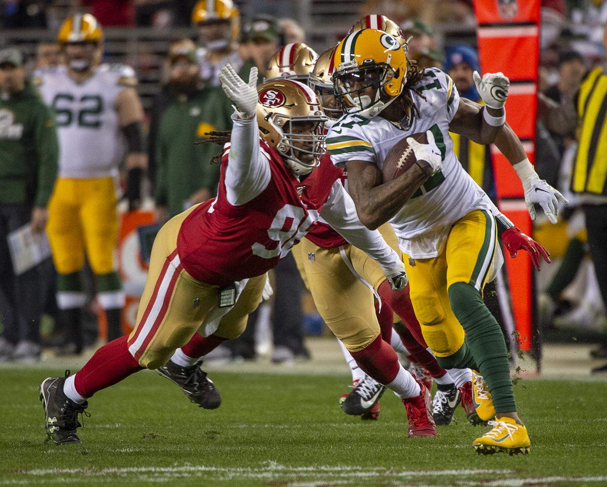 San Francisco 49ers defensive end Kentavius Street (95) tackles Green Bay Packers wide receiver Davante Adams (17) in the fourth quarter during the NFC Championship at Levi’s Stadium on Sunday, Jan. 19, 2020 in Santa Clara.