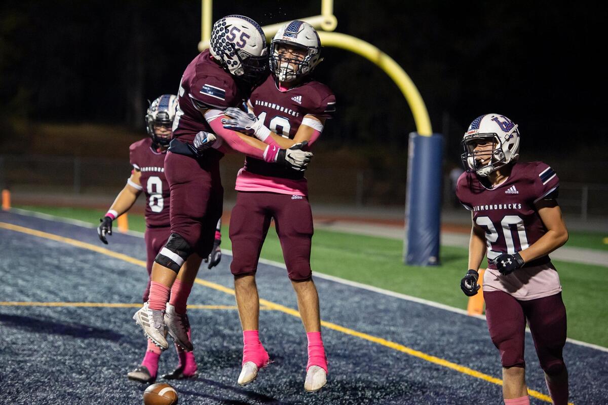 Chase Pritchard (10) celebrates in the end zone after scoring a touchdown for the Diamondbacks during the first quarter in the game against Rosemont on Friday night at Union Mine High School in El Dorado.