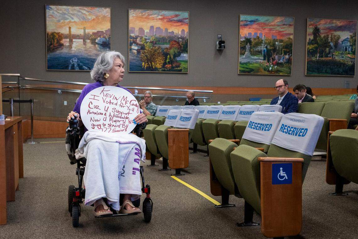 Yolanda Villanueva, who lives in the Wong Center in the Railyards, returns to the gallery after speaking at the Railyards Public Financing Authority meeting in the Sacramento City Council chamber on Tuesday.
