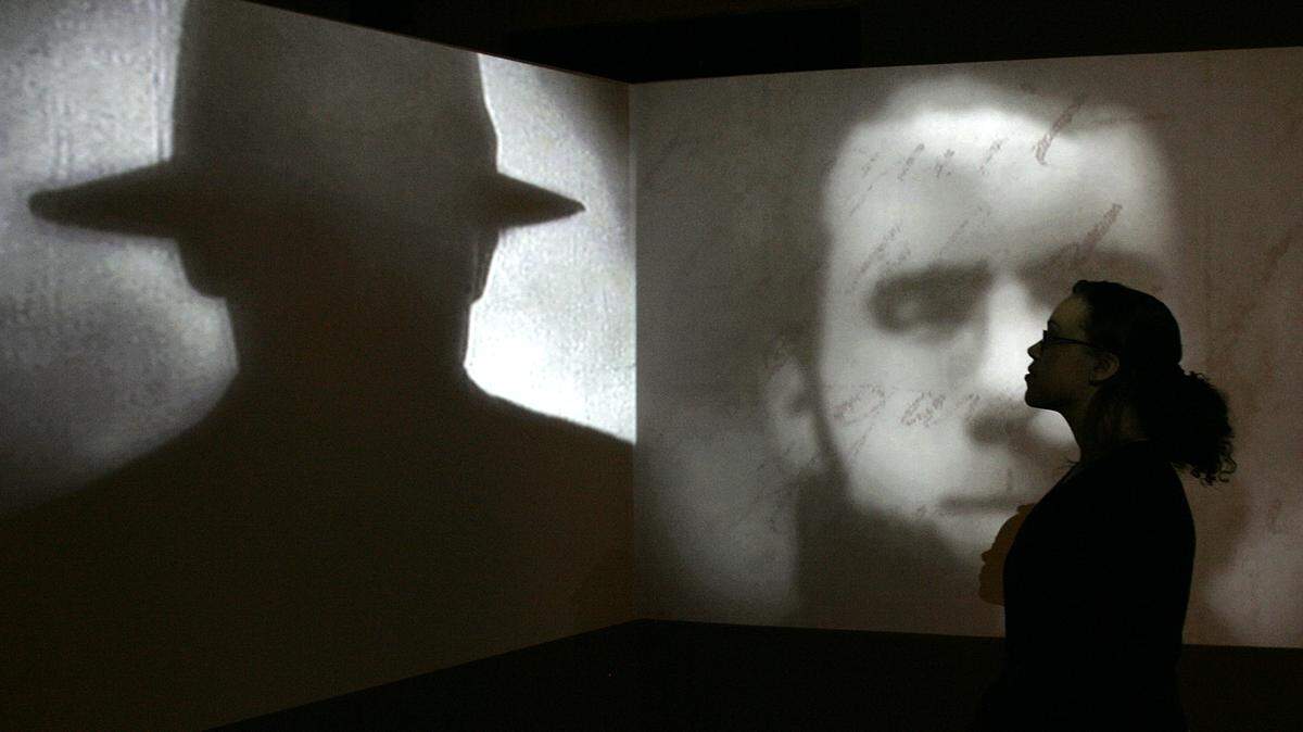 A member of staff poses stands in front of a screen showing a short movie about Jack the Ripper during a press preview for the exhibition “Jack the Ripper and the East End” at the Museum in Docklands, London, Wednesday, May 14, 2008. The exhibition, which will open to the public on Thursday, displays for the first time surviving original documents, including police files, photographs and letters from the public to highlight the serial killer, who allegedly murdered 11 women between 1888 and 1891 in London’s East End. (AP Photo/Akira Suemori)