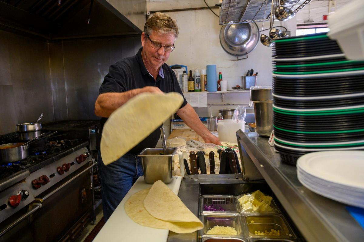 Owner/chef Dave Hanke of Nopalitos Southwestern Café in East Sacramento tosses tortillas in 2019.