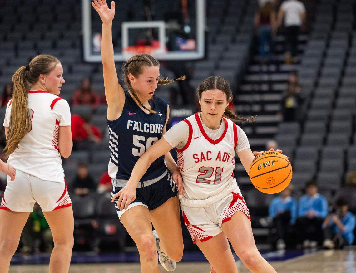 Sacramento Adventist Capitals guard Kyla Friedrich dribbles past the Forest Lake Christian Falcons’ Jordan Bell in the CIF Sac-Joaquin Section Division VI girls basketball championship on Friday at Golden 1 Center.