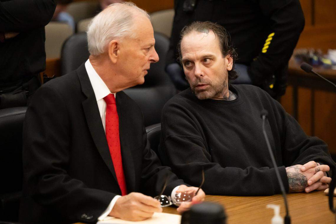 Joseph Paul DeMarco speaks with defense attorney Russell W. Miller Jr. before he was sentenced on Friday for the 2024 drive-by shooting murder of James Roseman. The murder of Roseman, a Black man, was determined to be a hate crime.