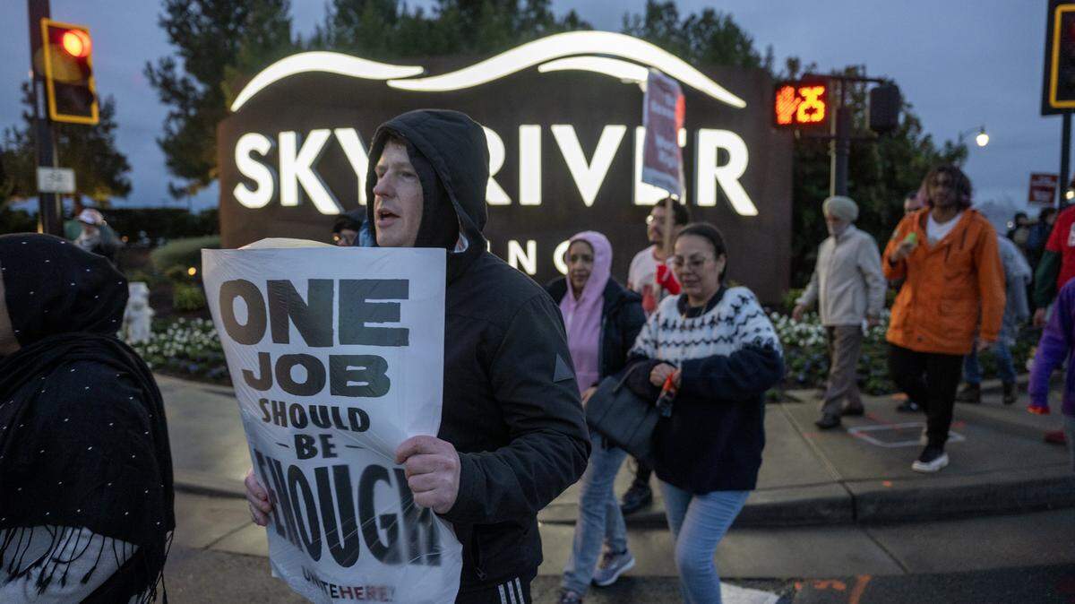 Matt Ishii pickets with Sky River employees and supporters outside the casino for better wages and benefits on Tuesday, Feb. 17, 2026, in Elk Grove.