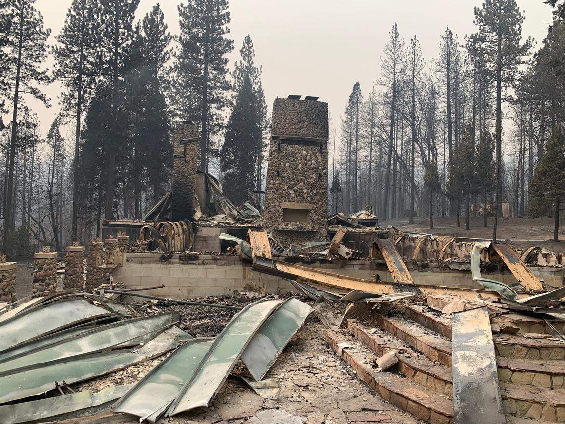 Two chimneys stand at Camp Okizu on Thursday, Sept. 10, 2020, after the summer camp for children with cancer and their families was burned by the Bear Fire.