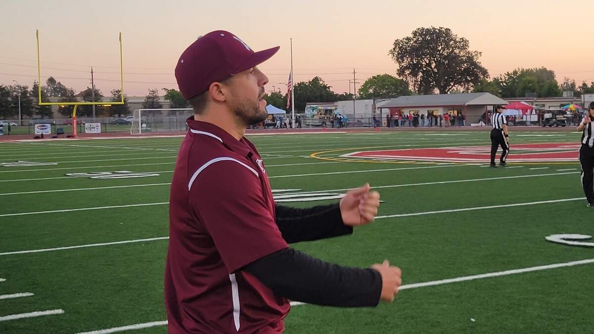 Hiram Johnson coach Alex Gomes-Coelho signals to his offense during a 54-27 win over Galt on Friday, Sept. 16, 2022.