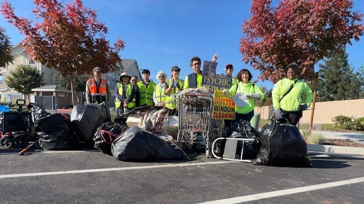 The Elk Grove Anti-Trash Community Cleanups group poses for a photo after cleaning up along Auberry Drive, East Stockton Boulevard and Sheldon Road in early November.