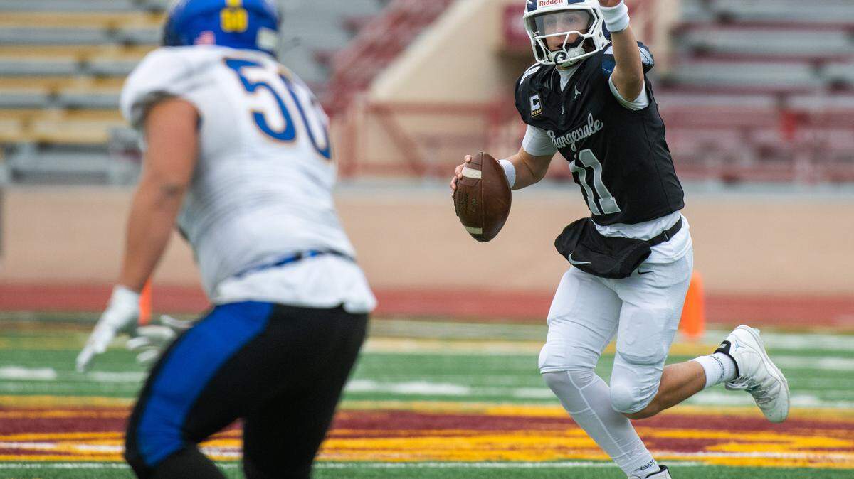 Casa Roble Rams quarterback Aidan Lopez (11) directs a receiver as Sutter Huskies linebacker Kristian Montero (50) drops back into coverage in the CIF Sac-Joaquin Section Division V championship at Hughes Stadium in Sacramento on Friday, Nov. 28, 2025.