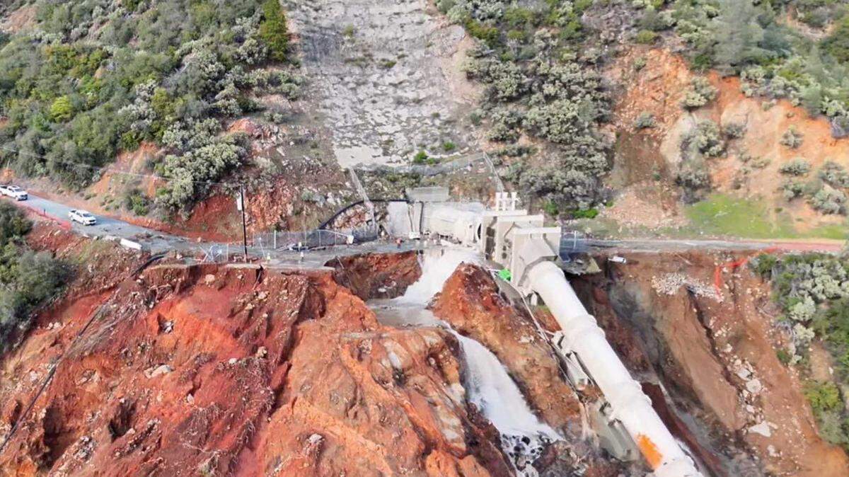 An aerial view shows water pouring from a damaged penstock pipe near the New Colgate Powerhouse along the Yuba River south of Dobbins on Friday, Feb. 13, 2026. The Yuba Water Agency said the penstock was isolated and there was no threat of flooding downstream following the incident.