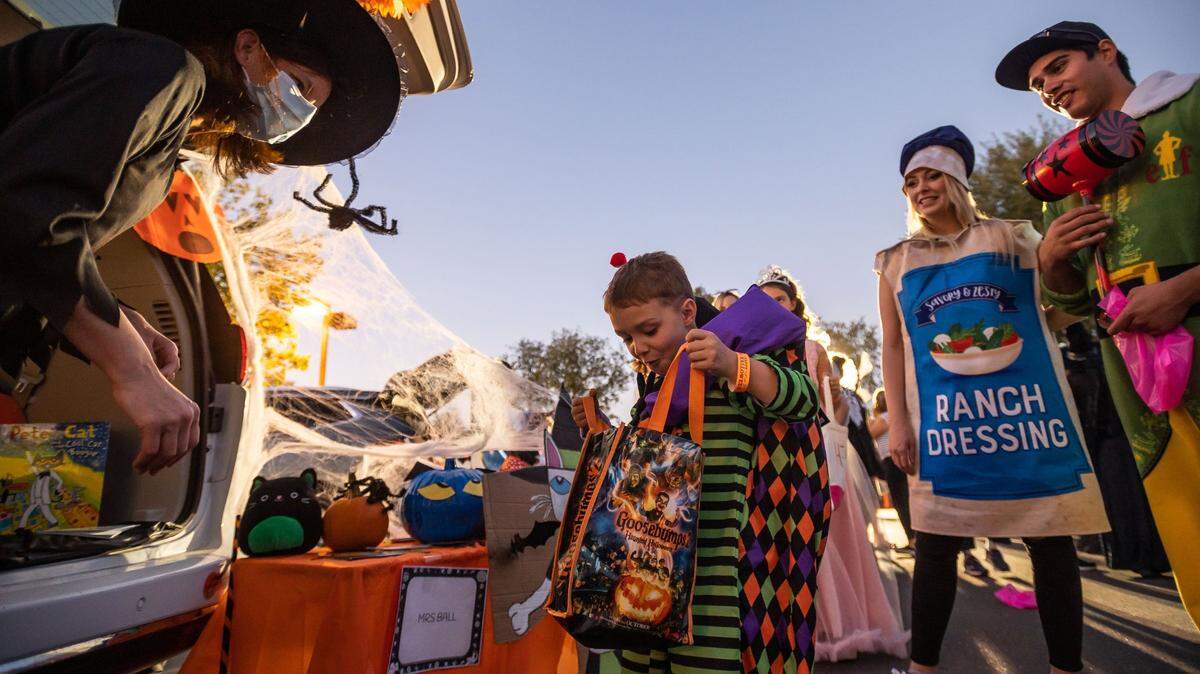 Florence Markofer Elementary School student Hayden Feist, 5, who is dressed as a scary clown, gets candy during a fundraiser at the school in Elk Grove in October..