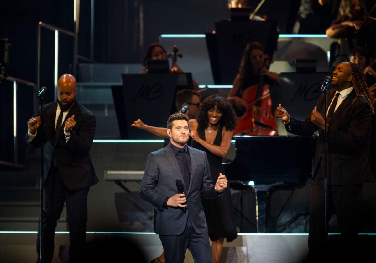Michael Bublé is backed by singers and a 36-piece orchestra as he performs on his Higher Tour at Golden 1 Center in Sacramento on Saturday.