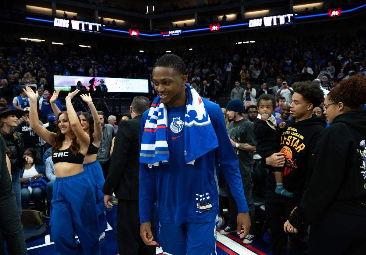 Sacramento Kings guard De’Aaron Fox (5) walks of the court after seeing his family as the Kings beat the Portland Trail Blazers 121-82 at Golden 1 Center on Sunday, April 14, 2024 in Sacramento.