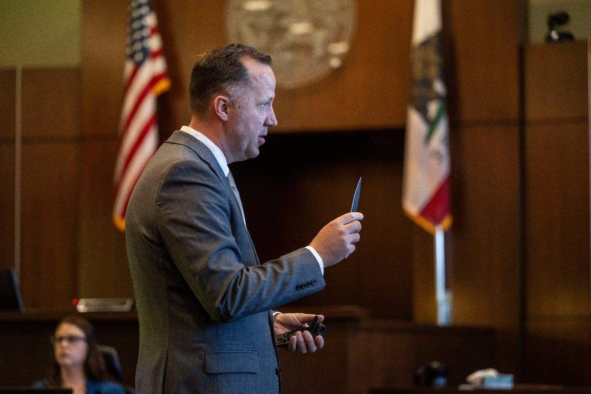 Yolo County prosecutor Frits Van de Hoek holds a knife Monday, May 5, 2025, similar to the one he alleges that former UC Davis student Carlos Reales Dominguez used during a series of stabbings in 2023. It was the first day of the trial for Dominguez, who is accused of murder and attempted murder.