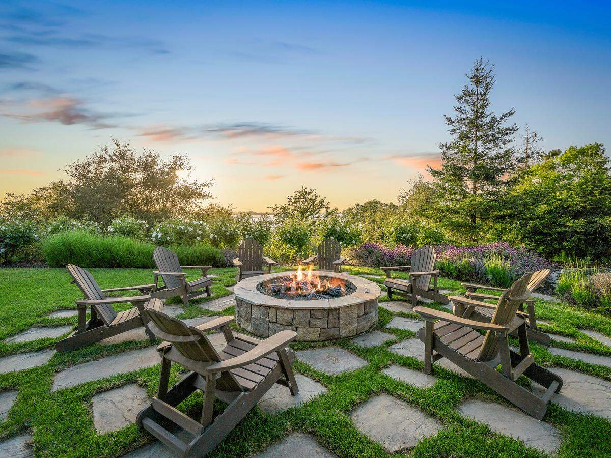 The El Dorado HIlls home for sale includes a fire pit area on its 10 acres overlooking Folsom Lake.